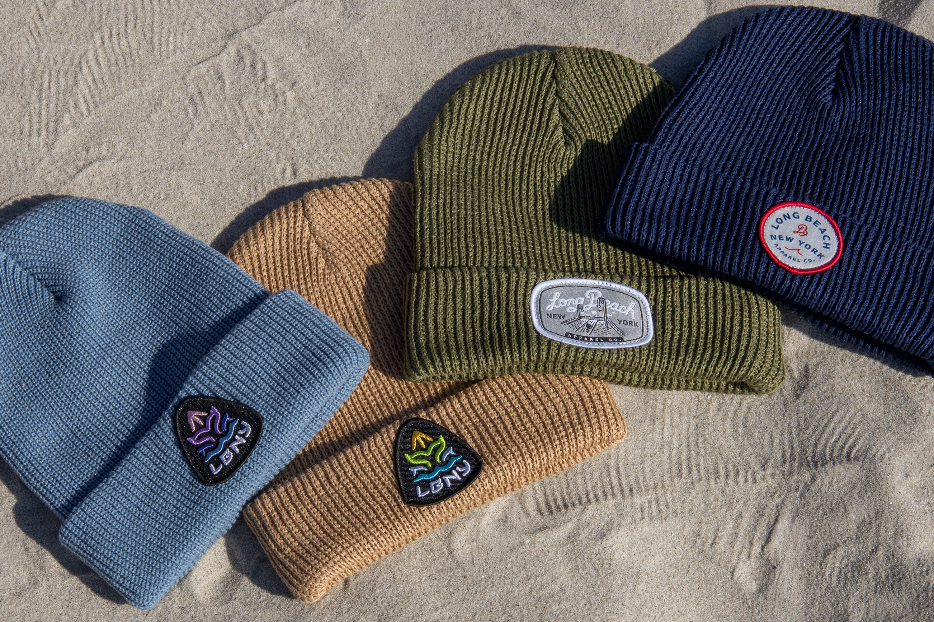 Beanies on Sand background